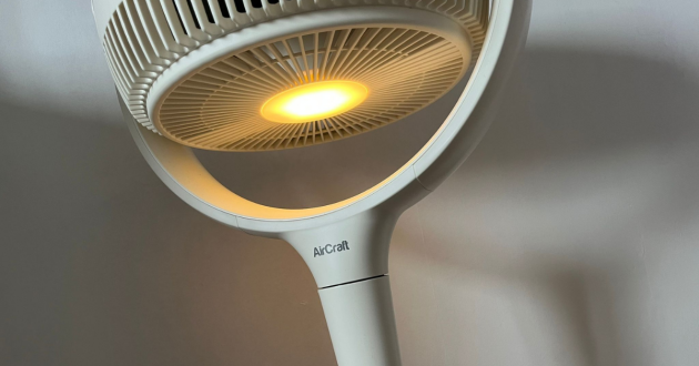 Mumsnet home editor Poppy O'Neill hand testing the AirCraft LUME Quiet Air Circulator Fan