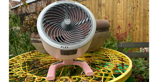 Mumsnet home editor Poppy O'Neill testing the Shark FlexBreeze HydroGo Pro Misting Fan