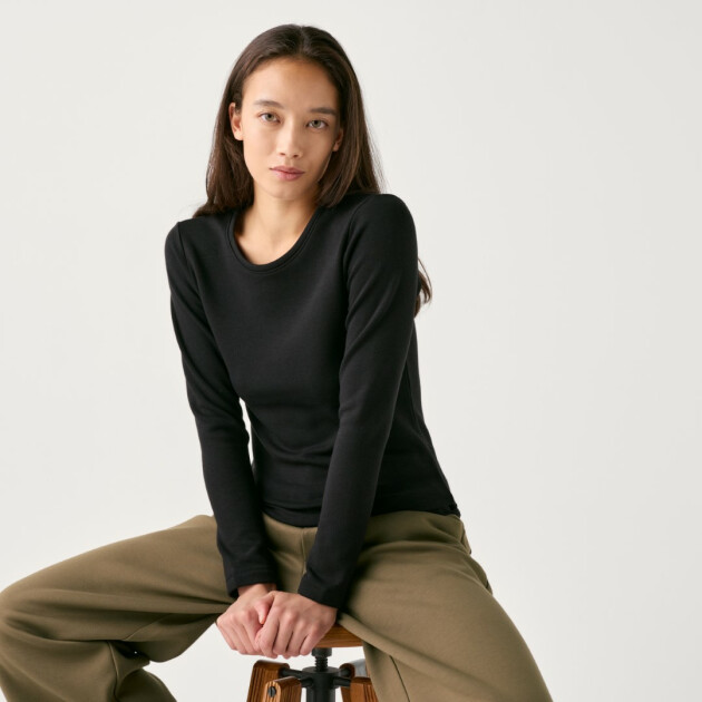 A model wears Uniqlo's Women’s HEATTECH Ultra Warm Crew Neck T-Shirt