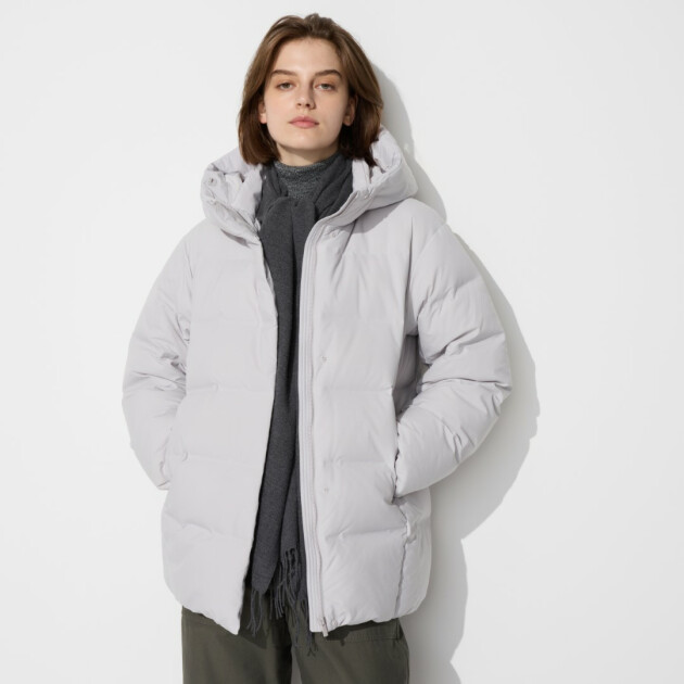 A woman models Uniqlo's Women’s Seamless Down Short Coat