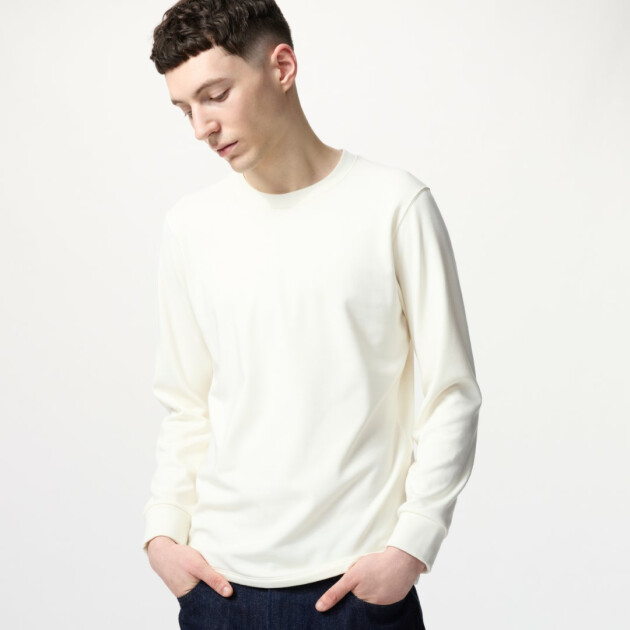 A model wears Uniqlo's Men’s HEATTECH Ultra Warm Crew Neck T-Shirt