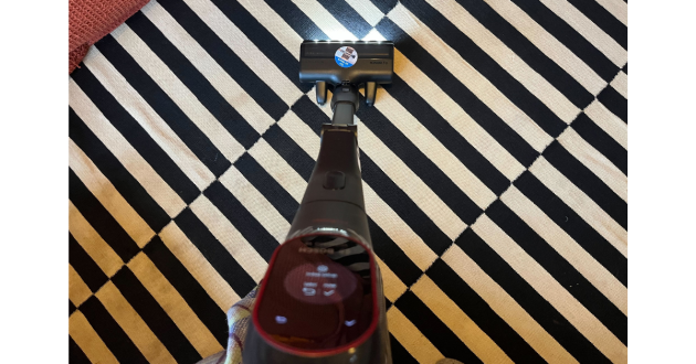 Mumsnet journalist Poppy O'Neill hand-testing the Bosch Unlimited 10 Cordless Vacuum Cleaner