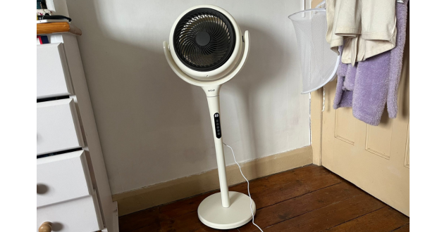 Mumsnet home editor Poppy O'Neill hand testing the AirCraft LUME Quiet Air Circulator Fan