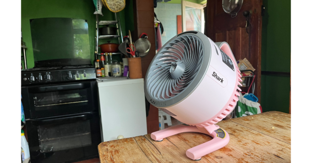 Mumsnet home editor Poppy O'Neill testing the Shark FlexBreeze HydroGo Pro Misting Fan