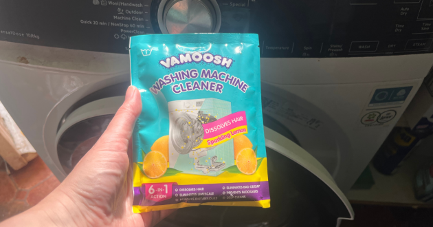 Mumsnet home editor Poppy O'Neill testing the Vamoosh Pet Hair Dissolver and Washing Machine Cleaner