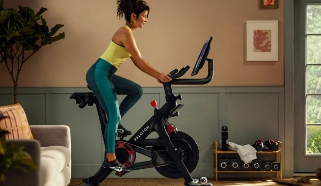 Woman on Peloton Bike+