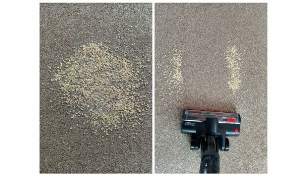 The brush head of a Henry Quick hoovering up porridge oats off a light brown carpet
