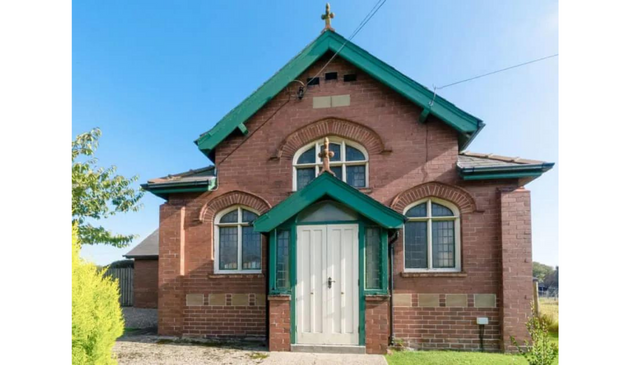 a converted chapel with green accents