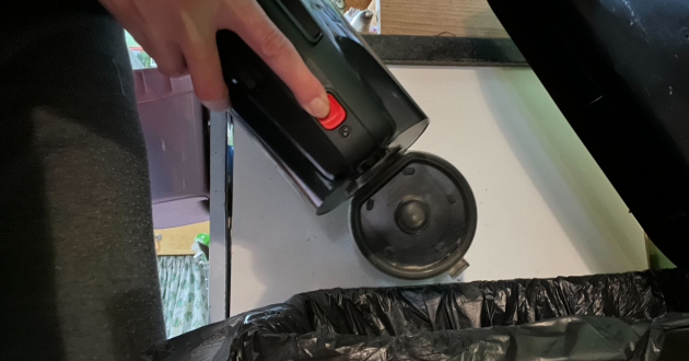 Mumsnet journalist Poppy O'Neill hand-testing the Bosch Unlimited 10 Cordless Vacuum Cleaner