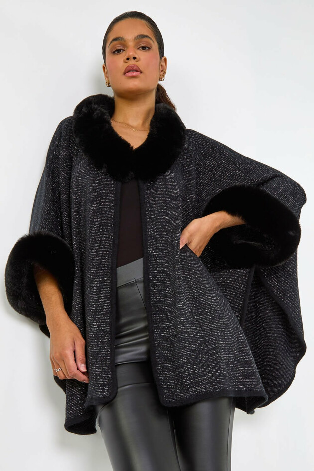 A model wears Roman's Black Faux Fur Button Up Poncho
