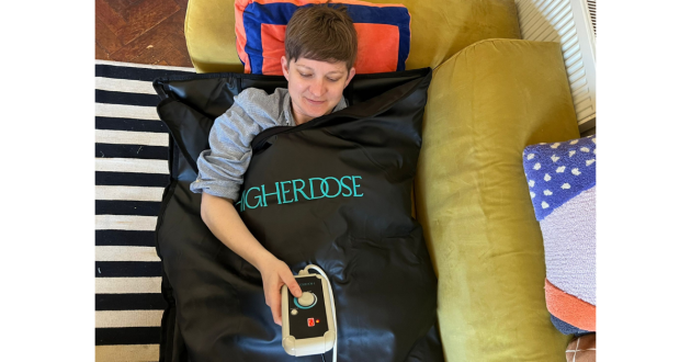 Mumsnet Home editor Poppy O'Neill testing the HigherDOSE Infrared Sauna Blanket