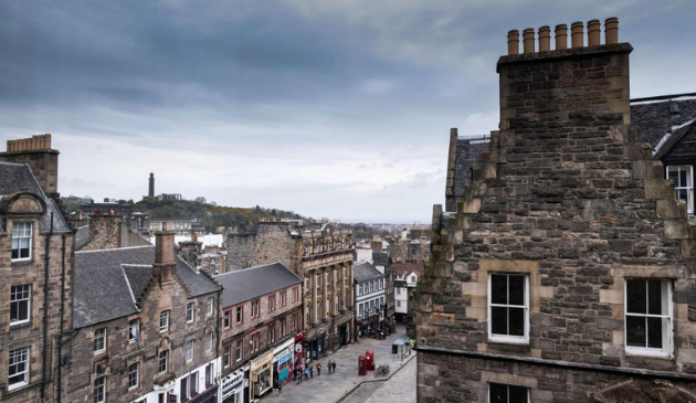 the view from a rooftop of an Edinburgh shopping street