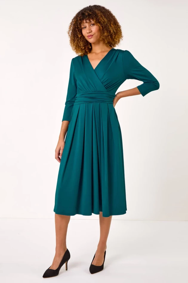 A model wears Roman's ​​Teal Mock Wrap V-Neck Stretch Midi Dress