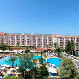 a view of a hotel in Mallorca with pools and balconies