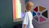 A child explores a sensory screen at the Autism & ADHD Show