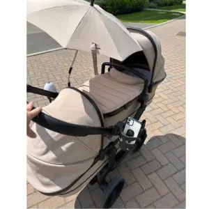 Mum pushing icandy peach 7 with umbrella