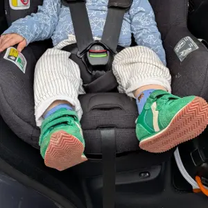 toddler sitting in Nuna TODL car seat
