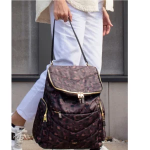 Woman holding Storksak Alyssa changing bag