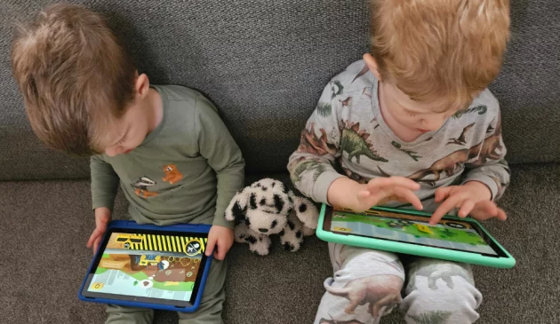 Two boys on Amazon Fire HD 10 Pro tablets