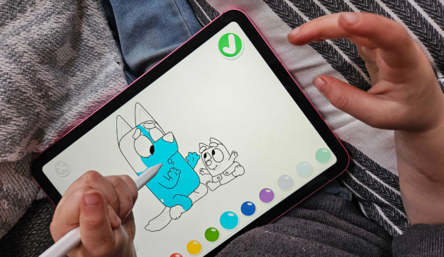 a child using the Apple iPad 10