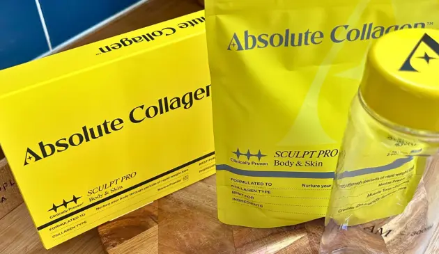Absolute Collagen SCULPT PRO box, evening powder pouch and clear shaker bottle on a kitchen worktop