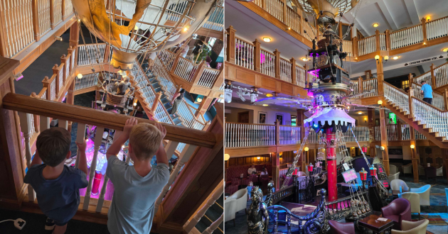 Children looking down into the Alton Towers Hotel Atrium at the suspended hot-air balloon