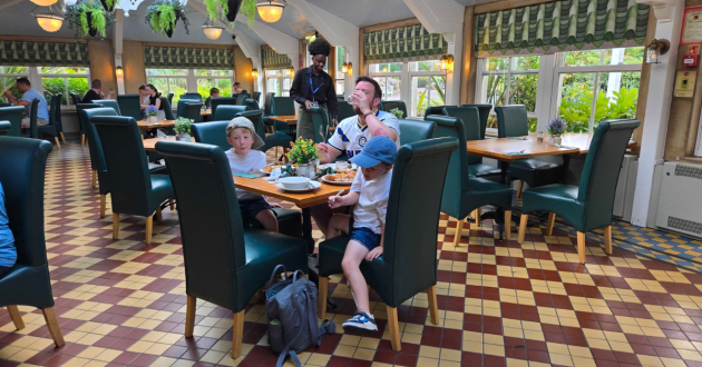 Family eating breakfast at a table in the Secret Garden Restaurant