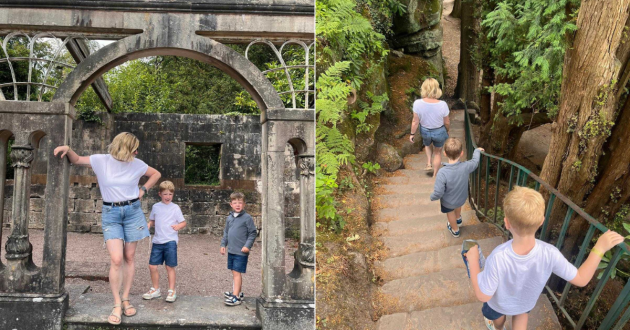 Family exploring stone arches and woodland steps in the Alton Towers gardens