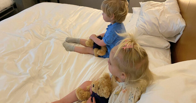 Kids on a bed at the Andaz London Liverpool Street hotel