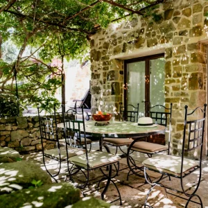 Table and chairs on the terrace outside at Country Kids in the South of France