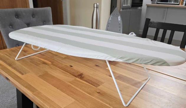 Argos Home Table Top Ironing Board set up on a wooden dining table