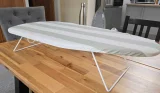 Argos Home Table Top Ironing Board set up on a wooden dining table