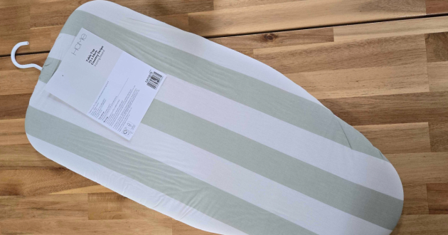 Argos Home Table Top Ironing Board folded flat with green and cream striped cover and hanging hook