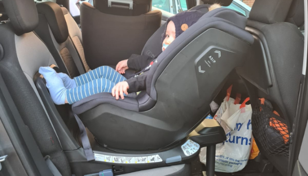 Toddler in Axkid Spinkid car seat