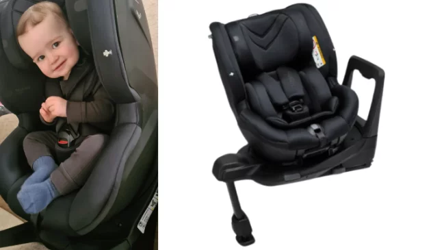 child in Axkid Spinkid car seat