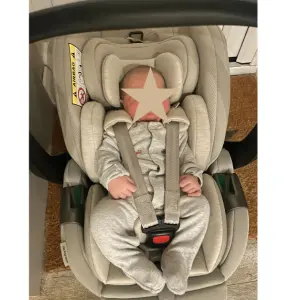 baby in Silver Cross Glide 360 Plus car seat