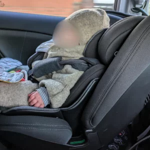 Baby in Silver Cross car seat