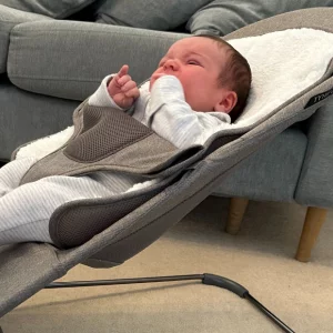 Baby lying in UPPAbaby Mira bouncer