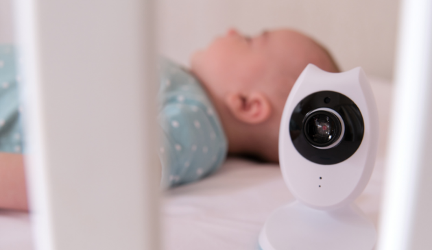 baby sleeping with baby monitor