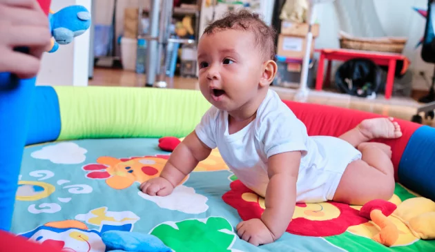 baby on play mat
