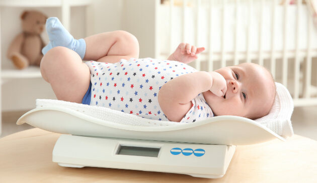 Baby on weighing scale