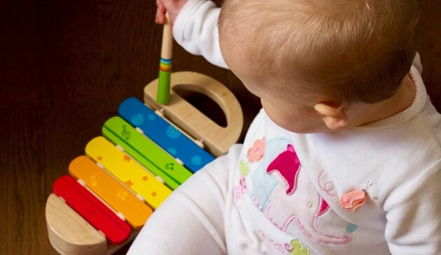 Baby playing instrument