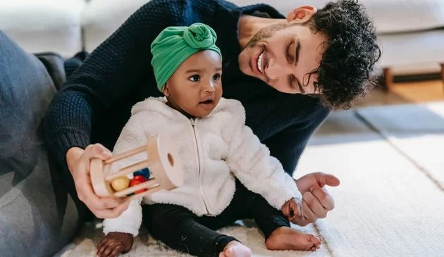 Baby playing with dad