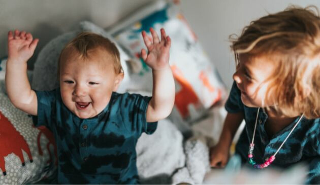 Baby with hands in the air