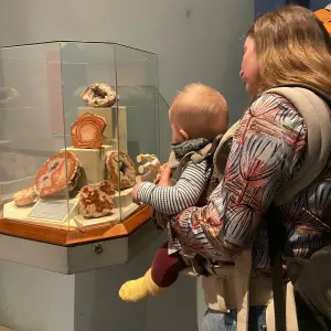 Mum wearing baby in BabyBjörn Baby Carrier Harmony in a museum