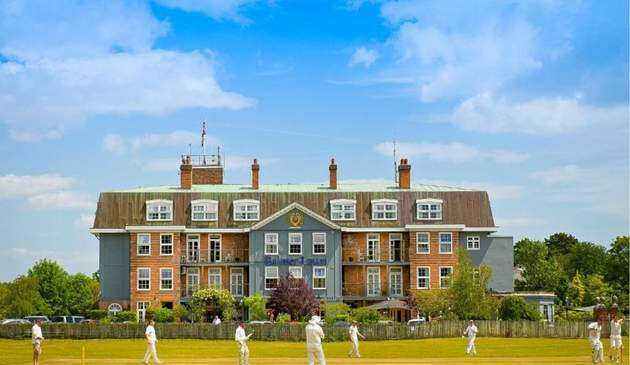 Picture of Balmer Lawn with guests playing cricket outside.