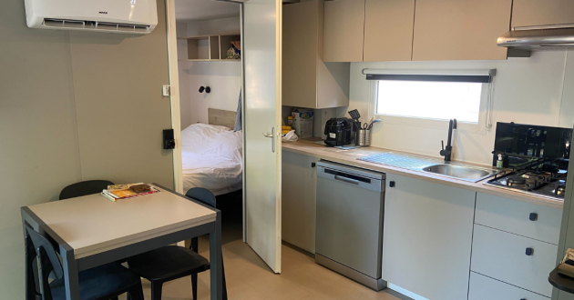 The kitchen and lounge in a three-bedroom Premium holiday home at Eurocamp Bella Italia