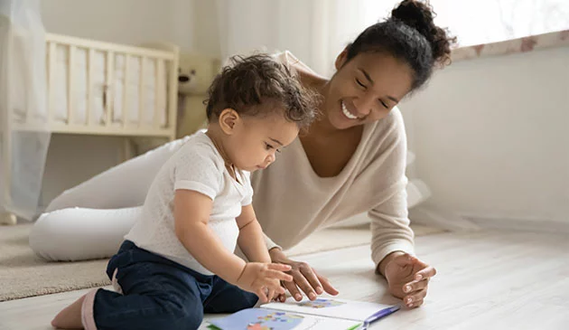 Mum reading with baby