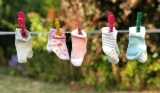 Baby socks hanging on washing line