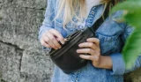 Woman wearing a leather bum bag